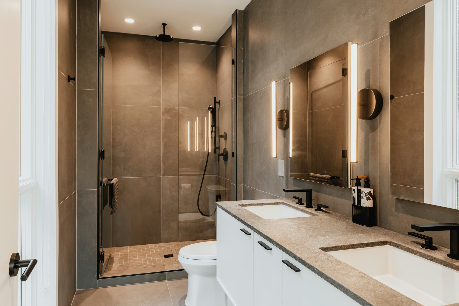 Designer bathroom featuring luxury fittings and natural materials